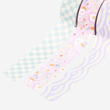 Three rolls of Flying Tiger Copenhagen paper tape, hobby craft supply with colorful, patterned paper tape for decorating and crafting.