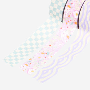 Three rolls of Flying Tiger Copenhagen paper tape, hobby craft supply with colorful, patterned paper tape for decorating and crafting.