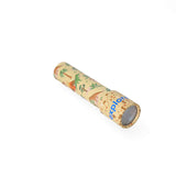 Colorful dinosaur kaleidoscope toy with rotating lenses, designed for children by Flying Tiger Copenhagen.