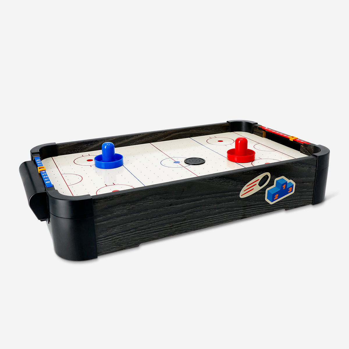 Flying Tiger Copenhagen classic air hockey game with a sleek black and red playing surface and two paddles for fast-paced fun.