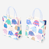 Two Flying Tiger Copenhagen snowflake gift bags for office gifts, featuring festive snowflake designs in a set of two.