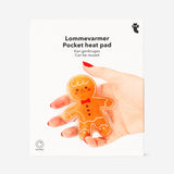 Flying Tiger Copenhagen gingerbread man pocket heat pad gadget with festive gingerbread design and soft fabric exterior.