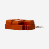 Flying Tiger Copenhagen chocolate bar clicking keyring gadget with a realistic chocolate bar design and clicking mechanism.