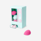 Set of 9 Flying Tiger Copenhagen makeup blender sponges in a vending machine for personal care use.