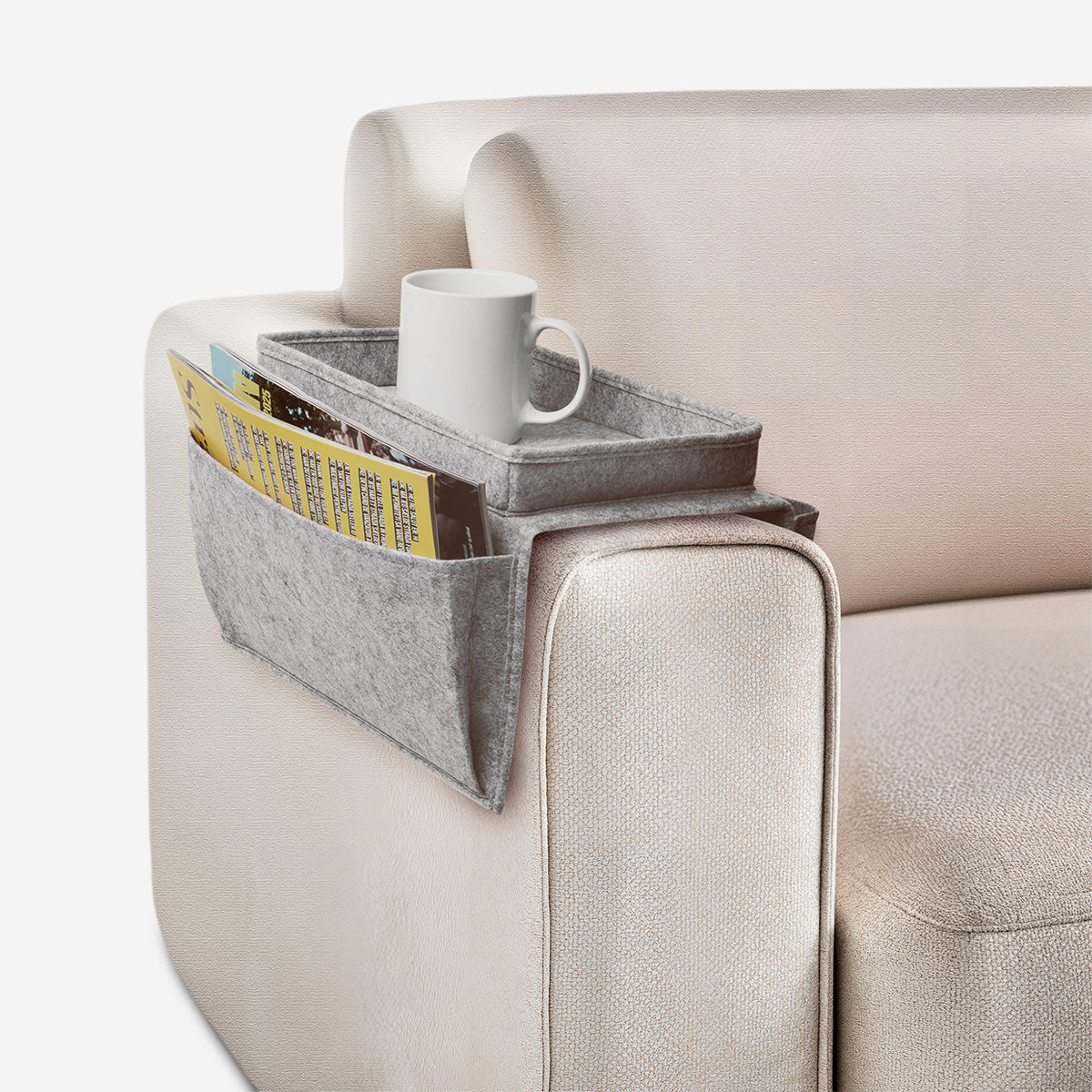 Grey armrest organiser for sofa
