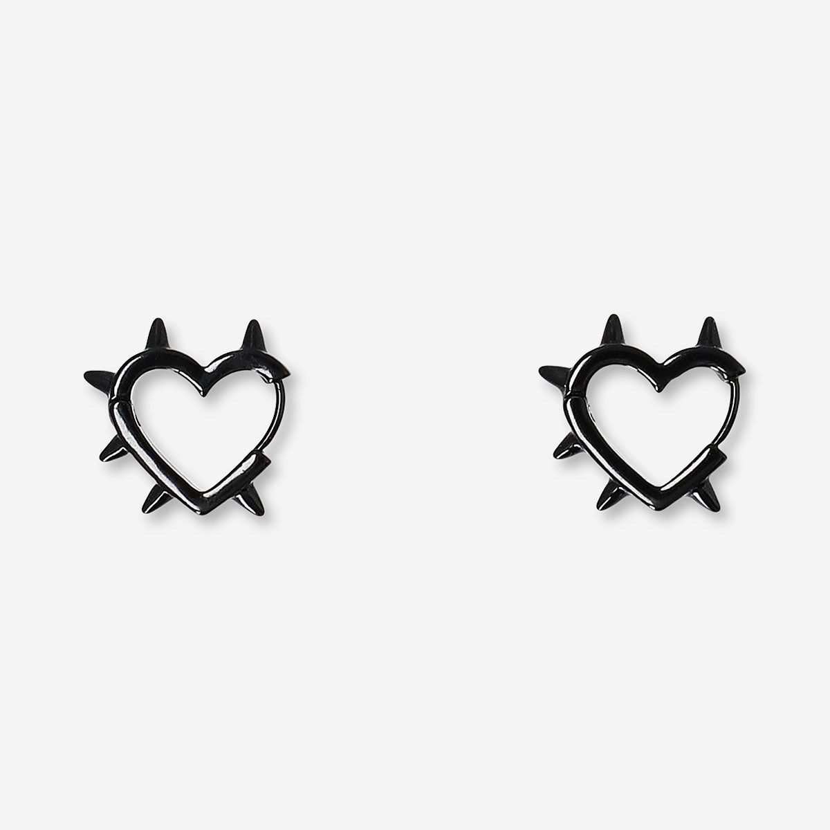 Black studded heart earrings made of textile, featuring a fashionable design from Flying Tiger Copenhagen.