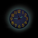 Glow in the dark wall clock by Flying Tiger Copenhagen, showing luminous numbers and hands on a modern home decor clock.