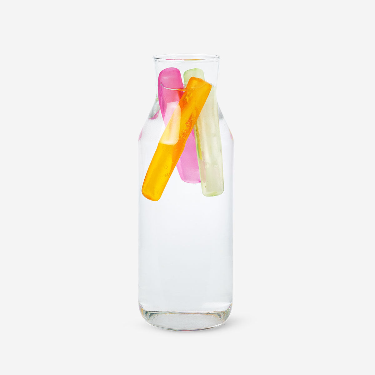 Six reusable ice blocks for bottles from Flying Tiger Copenhagen, shown in a clear container on a kitchen countertop.