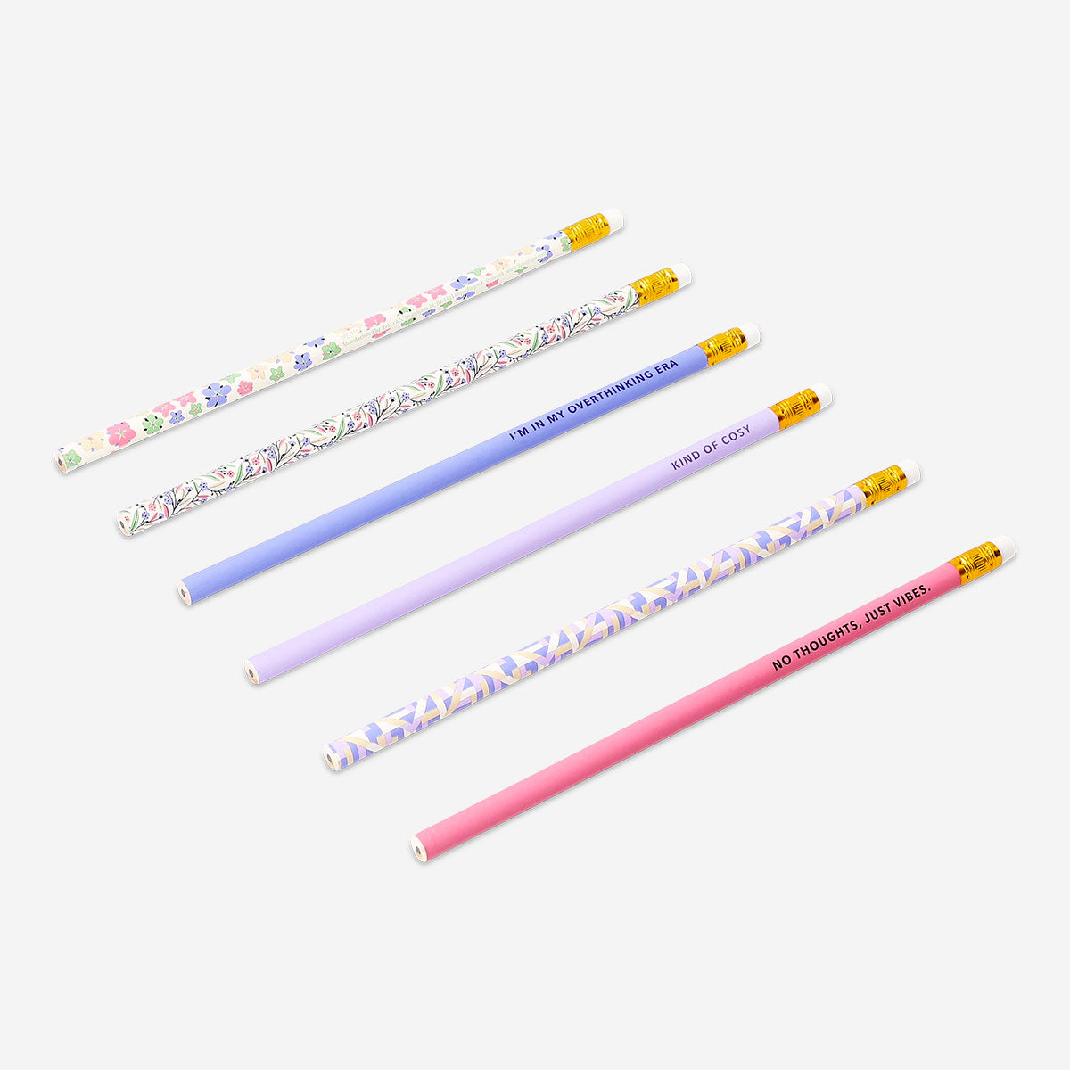 Set of six Flying Tiger Copenhagen office pencils with colorful printed designs on wooden bodies.
