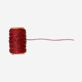 Red rope ribbon from Flying Tiger Copenhagen, 15 meters long, shown coiled and ready for office or craft use.