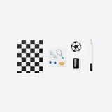 Mini soccer-themed stationery kit in a Flying Tiger Copenhagen backpack, featuring pens, notebooks, and office supplies.