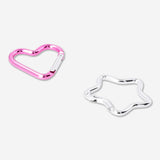 Two Flying Tiger Copenhagen textile heart and star-shaped carabiners attached to a keychain or fabric, showcasing colorful metal clips.