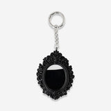Flying Tiger Copenhagen gothic textile keyring featuring a decorative picture frame design with dark, intricate details.