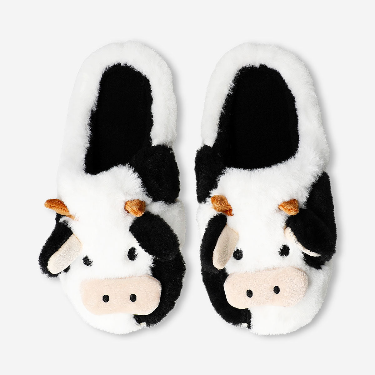 Flying Tiger Copenhagen cow slippers in size 39/40, soft textile footwear with cow print and cute cow face design.