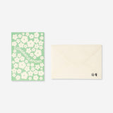 Office greetings card featuring floral design and congratulations message, by Flying Tiger Copenhagen.