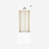 Set of four white twisted dinner candles for home decor by Flying Tiger Copenhagen, shown in the image.