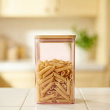 Pink glass storage container with lid, 1.7L from Flying Tiger Copenhagen's Designer Collection, suitable for kitchen storage.