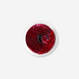 Flying Tiger Copenhagen glitter eyeshadow flakes in plum color, sparkling makeup accents for eyes and creative looks.