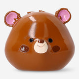 Brown bear-shaped money bank from Flying Tiger Copenhagen, 11 cm tall, featuring a playful bear design for saving coins.