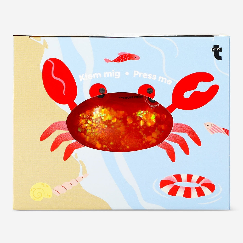 Red crab press me toy gadget from Flying Tiger Copenhagen featuring a playful crab design with movable limbs.