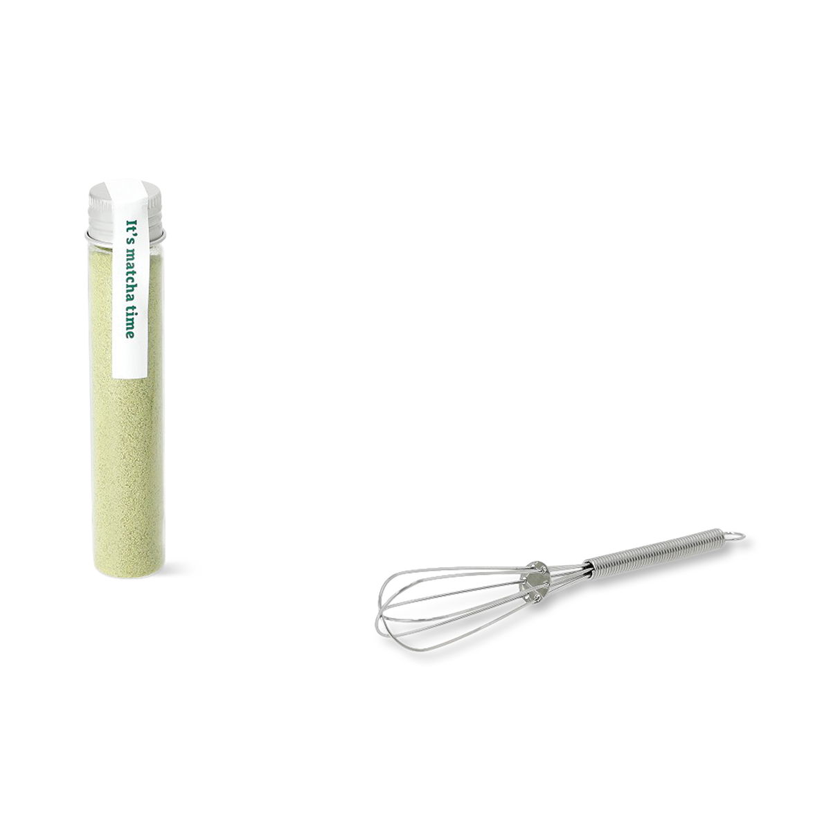 Flying Tiger Copenhagen matcha kit with green mug, bamboo whisk, and matcha powder for preparing traditional green tea.