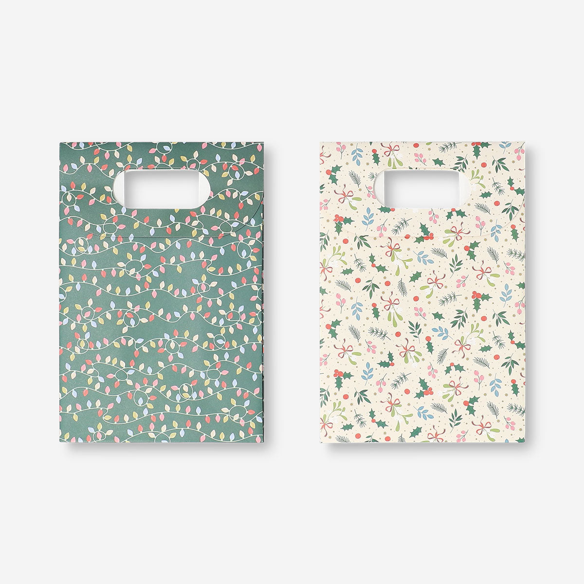 Two Christmas print gift bags for office use, featuring festive holiday designs by Flying Tiger Copenhagen.