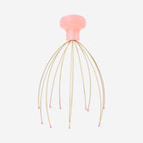 Flying Tiger Copenhagen gold head massager gadget with multiple rollers for relaxing scalp massage.