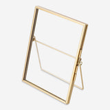 Gold 11x16 cm picture frame from Flying Tiger Copenhagen, showcasing a sleek home decor accent with a shiny finish.