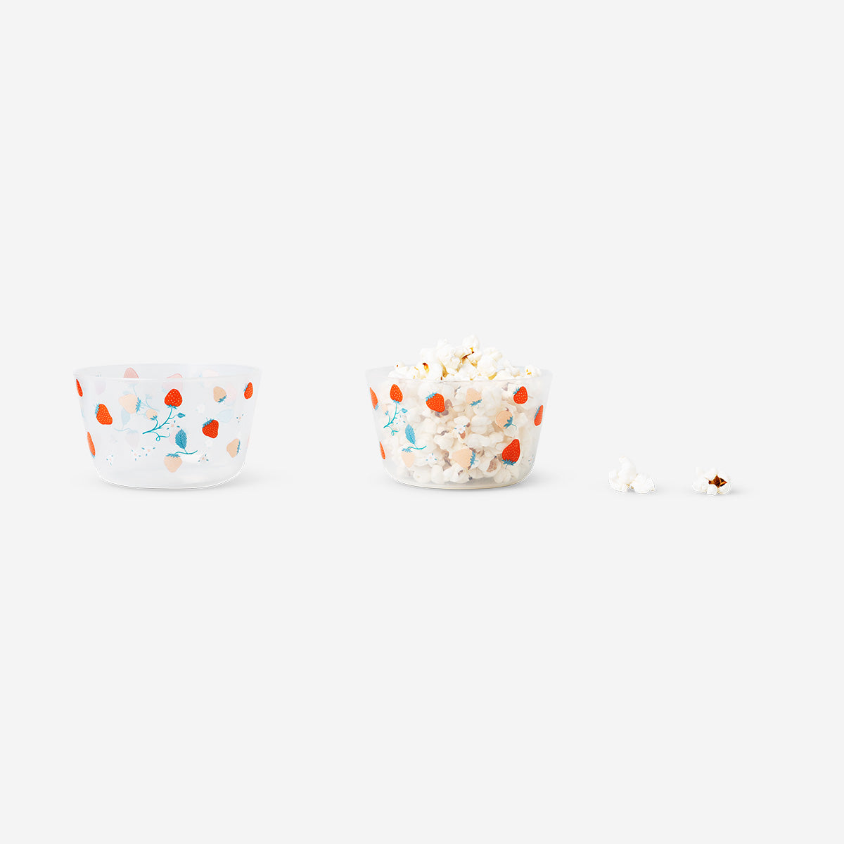 Two party bowls with strawberry print from Flying Tiger Copenhagen, perfect for summer gatherings and dessert serving.
