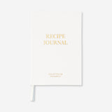 Flying Tiger Copenhagen office recipe book with colorful pages open, featuring various recipes and kitchen illustrations.