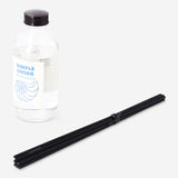 Flying Tiger Copenhagen reed diffuser with sea salt fragrance, featuring glass bottle and natural reeds for home scenting.