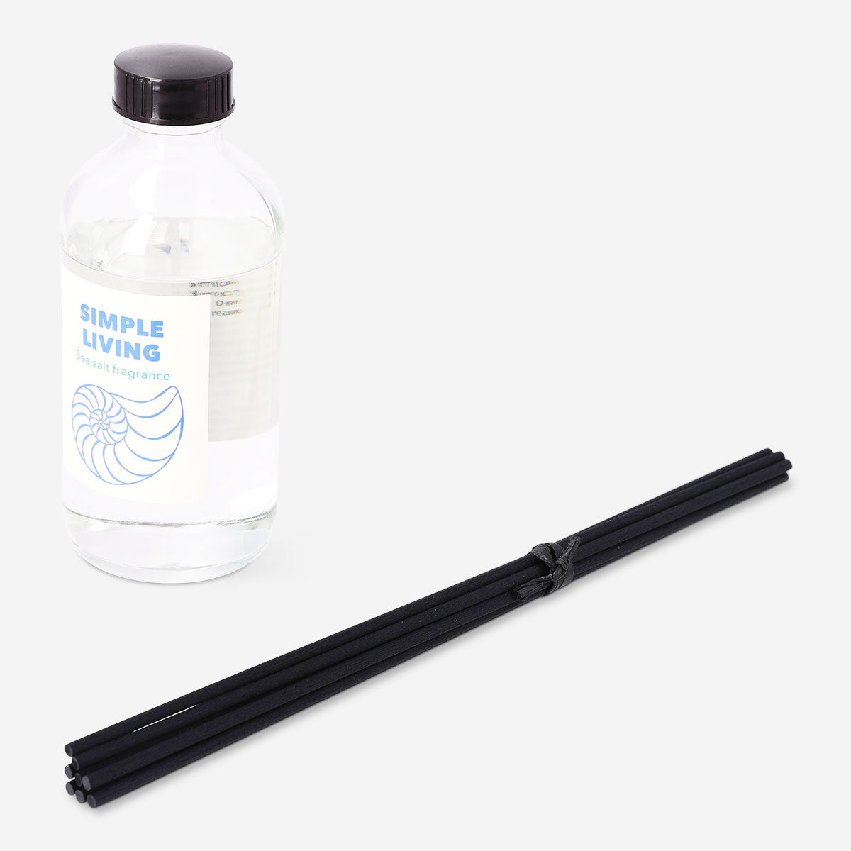 Flying Tiger Copenhagen reed diffuser with sea salt fragrance, featuring glass bottle and natural reeds for home scenting.