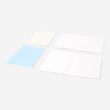 Set of four Flying Tiger Copenhagen A5 solid color notebooks for office or note-taking, with colorful covers and smooth pages.