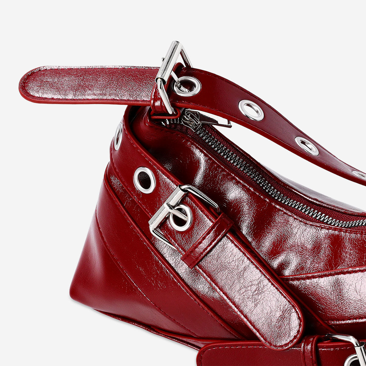 Red textile shoulder bag with buckle details from Flying Tiger Copenhagen, featuring a stylish and functional design.