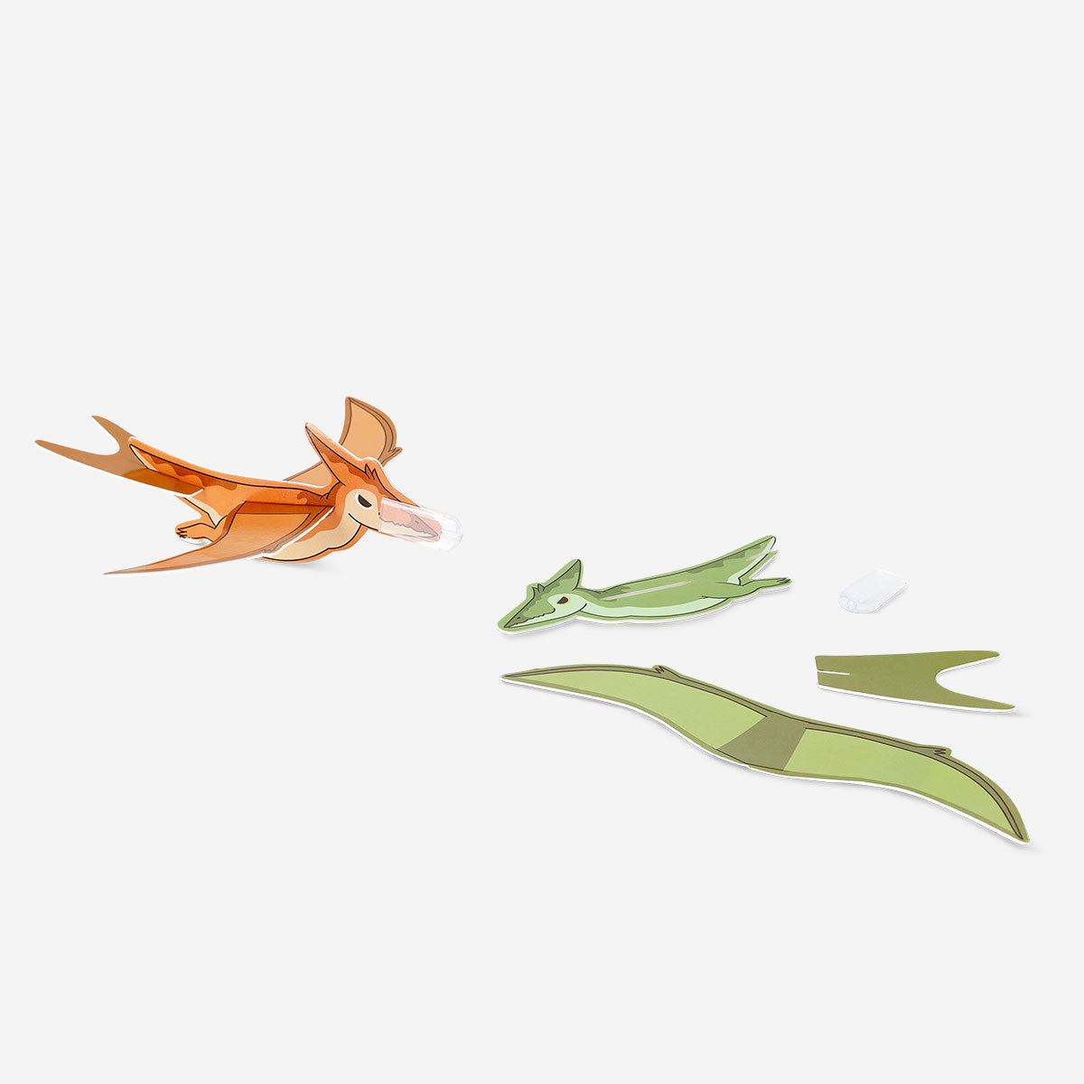 Three colorful DIY flying dinosaur toys from Flying Tiger Copenhagen, with wings and claws, ready for assembly and play.