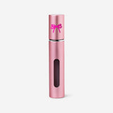 Pink refillable 8ml travel perfume bottle from Flying Tiger Copenhagen, compact and stylish for on-the-go fragrance.