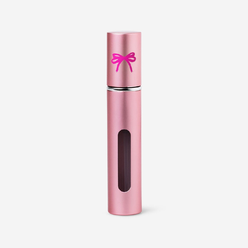 Pink refillable 8ml travel perfume bottle from Flying Tiger Copenhagen, compact and stylish for on-the-go fragrance.