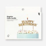 Colorful happy birthday cake candle from Flying Tiger Copenhagen, designed for festive party celebrations.