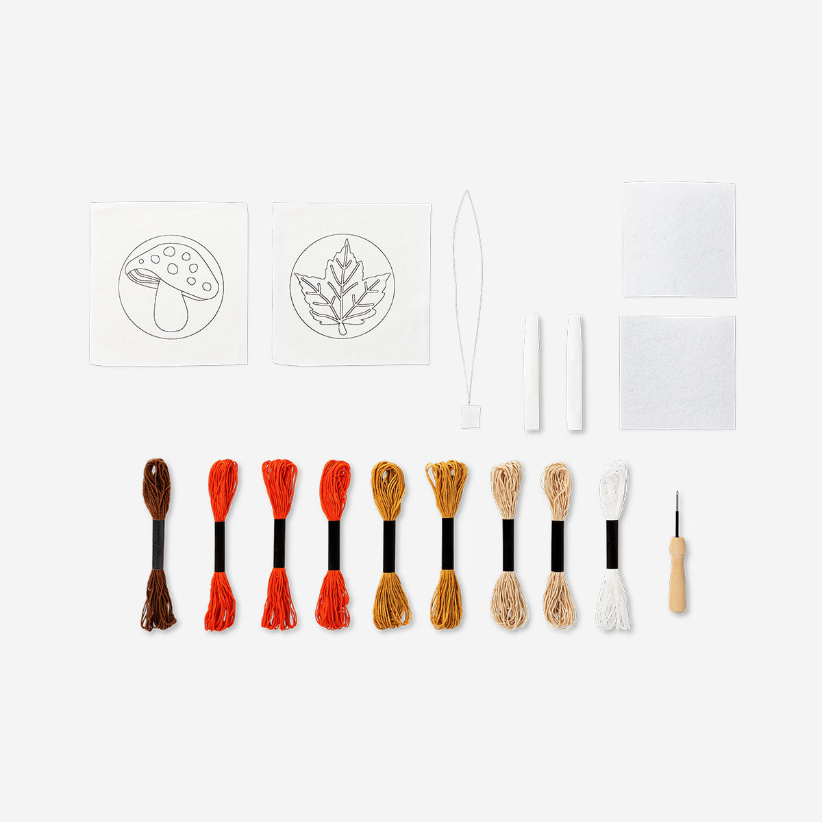 Two DIY punch needle coasters in vibrant colors, crafted for hobby crafting by Flying Tiger Copenhagen.