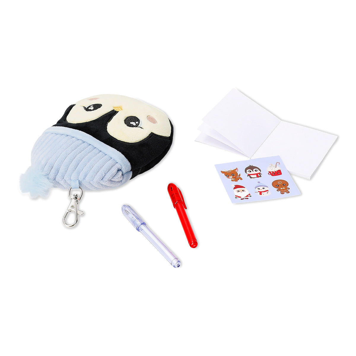 Office stationery kit featuring a plush penguin from Flying Tiger Copenhagen, including pens, pencils, and stationery accessories.