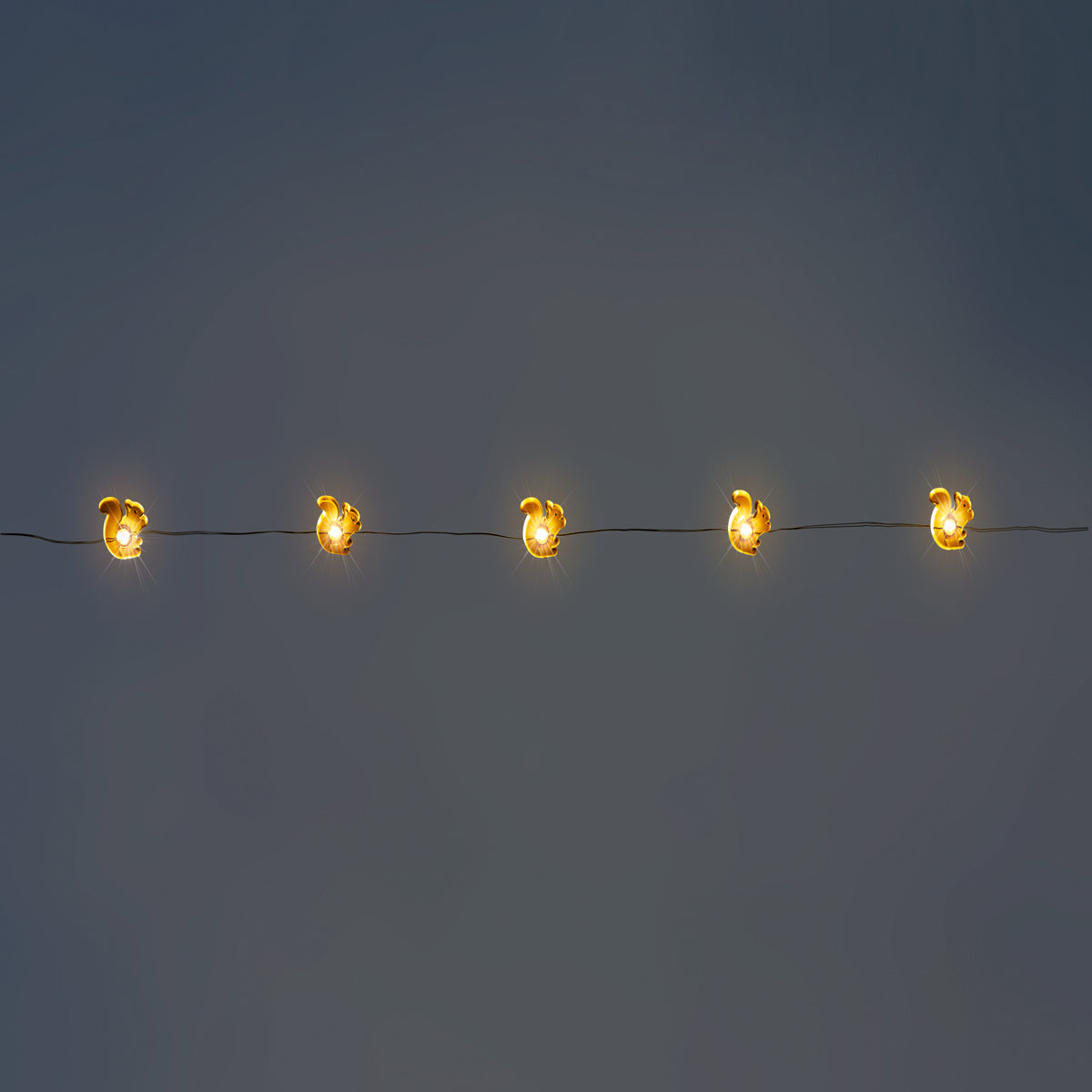 Brown squirrel string lights for home decor by Flying Tiger Copenhagen, featuring playful squirrel designs on a string of warm lights.