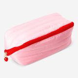 Quilted toiletry bag with strawberry print by Flying Tiger Copenhagen, featuring a compact personal care storage design.