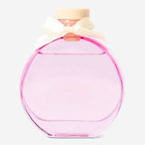 Flying Tiger Copenhagen reed diffuser with white tea fragrance in a clear glass bottle and natural reed sticks for home scenting.