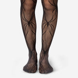 Adult spider tights by Flying Tiger Copenhagen, one size textile hosiery with a spider web design on black fabric.