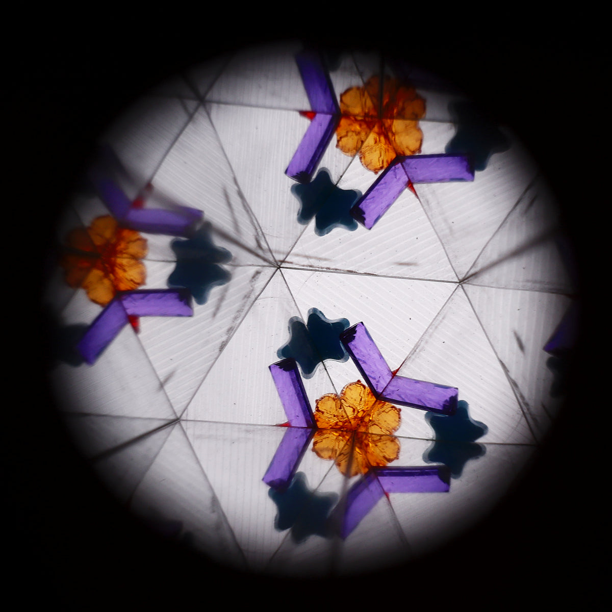Colorful unicorn kaleidoscope toy from Flying Tiger Copenhagen showing its rainbow design and viewing end.