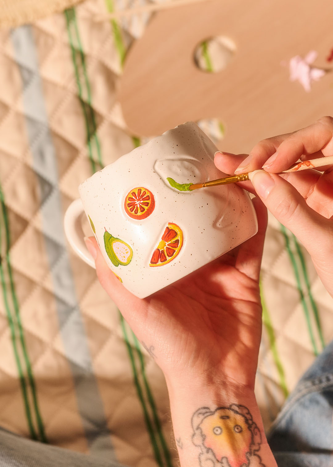 DIY ceramic mug with debossed fruit design, 330 ml capacity, by Flying Tiger Copenhagen, featuring colorful fruit patterns.