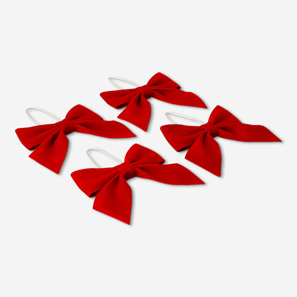 Set of four red velvet hanging bows for home decor, featuring plush texture and decorative design by Flying Tiger Copenhagen.