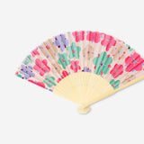 Foldable bamboo fan with abstract floral textile design by Flying Tiger Copenhagen, showing intricate flower patterns and natural bamboo frame.