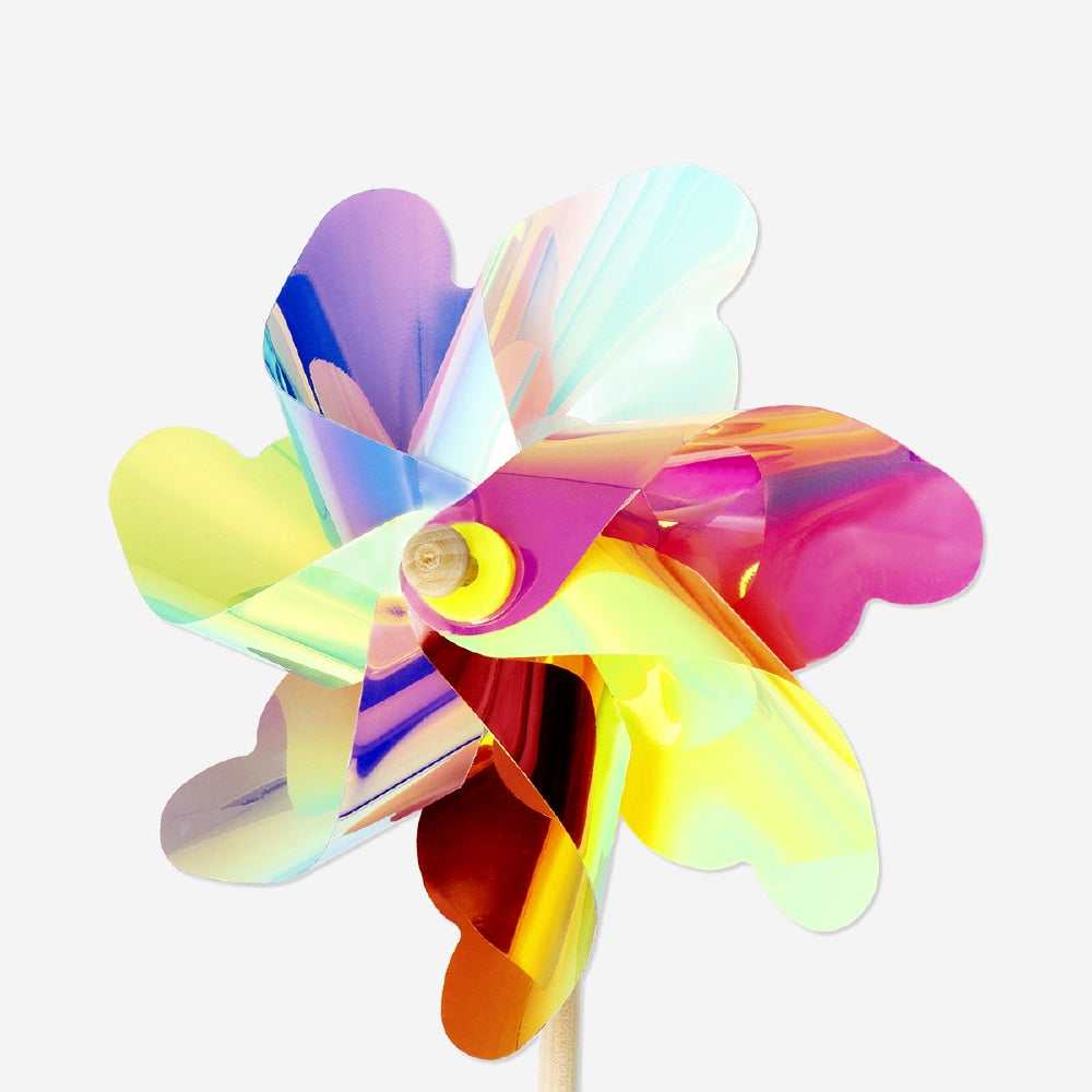 Colorful rainbow pinwheel toy from Flying Tiger Copenhagen, measuring 49x18 cm, with vibrant blades spinning in the wind.