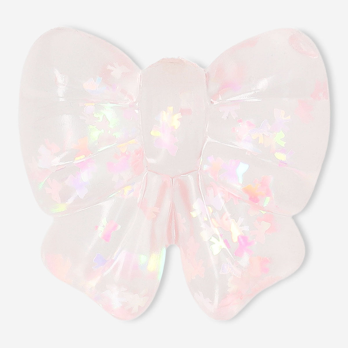 Pink Press Me Toy fidget bow gadget from Flying Tiger Copenhagen, colorful squeeze toy for stress relief and sensory fun.